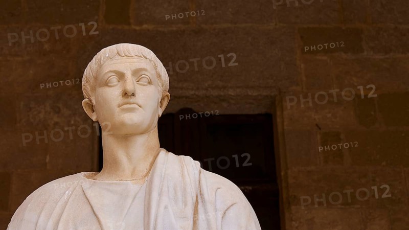 Ancient marble statue with distinct facial expression and headdress, statue from the 1st century BC, courtyard, Grand Master's Palace, Knights' Town, Rhodes Town, Rhodes, Dodecanese, Greek Islands, Greece, Europe