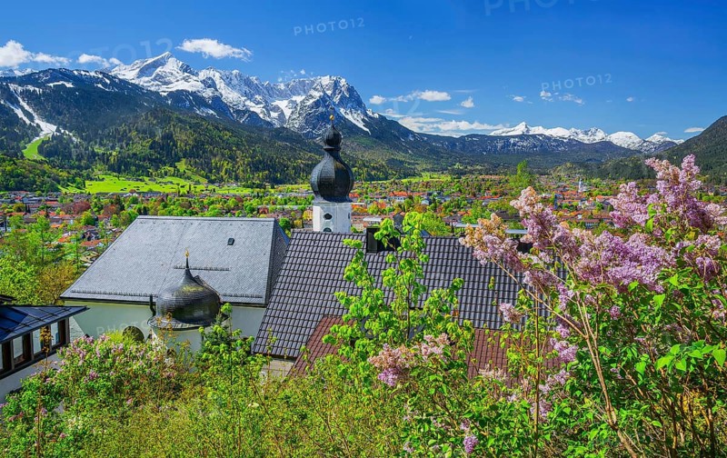 Pilgrimage church St. Anton in spring above the village in front of the Zugspitze group 2962m in the Wetterstein mountains, Garmisch-Partenkirchen, Loisachtal, Werdenfelser Land, Bavarian Alps, Upper Bavaria, Bavaria, Germany, Europe