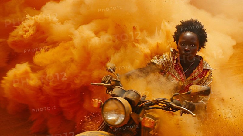 Person in gold suit speeding away on motorcycle with a massive explosion behind them, AI generated