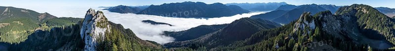 Aerial view, rocky summit of the Ettaler Manndl, view over mountain landscape and sea of clouds, high fog in the valley, Ammergau Alps, Bavaria, Germany, Europe