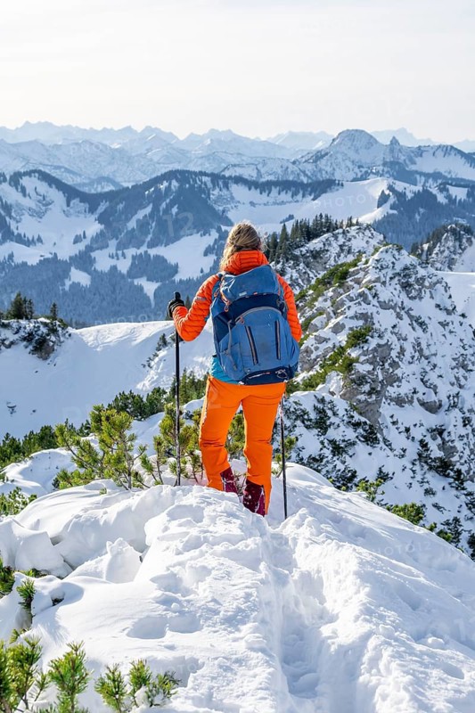 Hiker in winter climbing the Aiplspitz, Mangfall mountains, Bavarian Prealps, Bavaria, Tyrol, Germany, Europe
