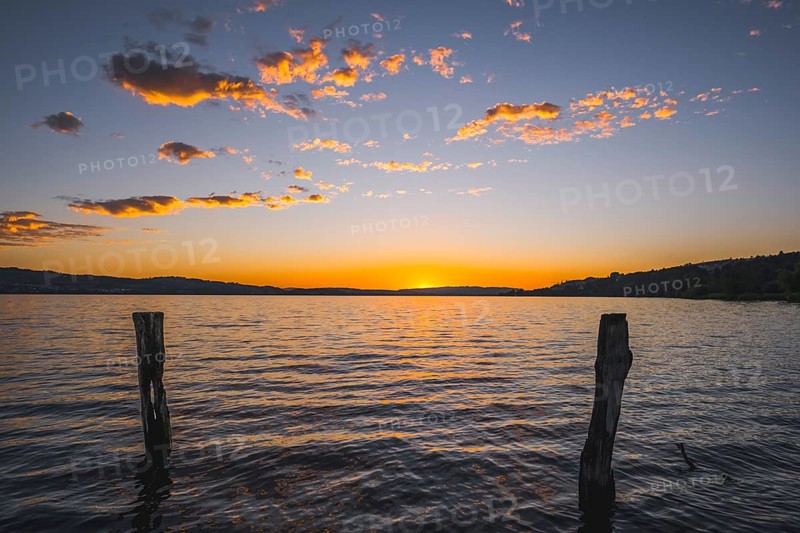 Sunset over Lake Sempach with glowing clouds, Sempach, Lucerne, Switzerland, Europe
