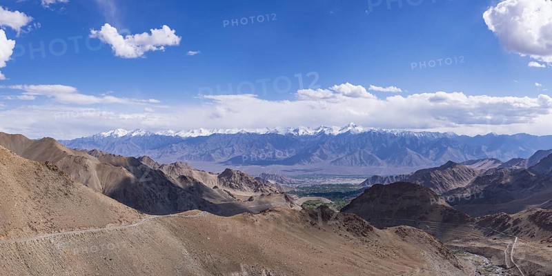 Panorama from the Khardong Pass, the second highest motorway pass in the world, over Leh and the Indus Valley to Stok Kangri, 6153m, Ladakh, Jammu and Kashmir, India, Asia