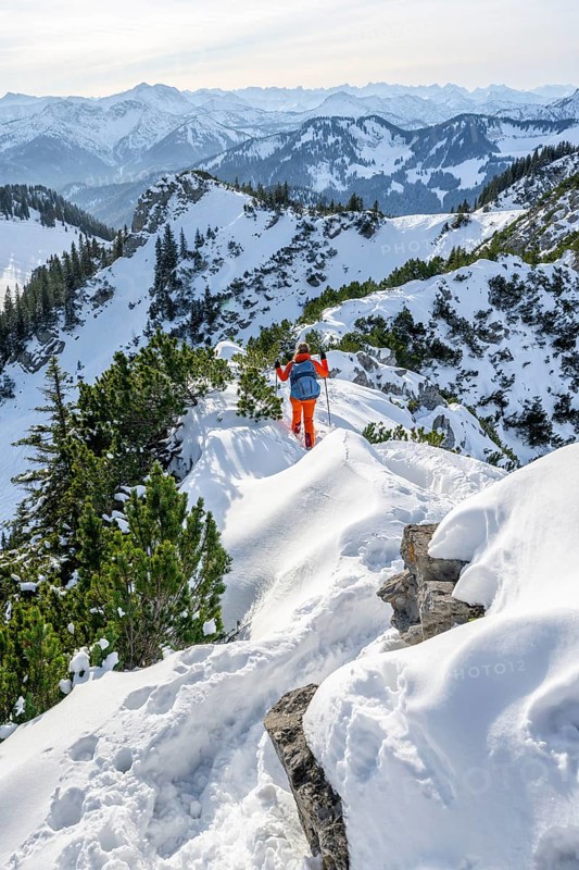 Hiker in winter climbing the Aiplspitz, Mangfall mountains, Bavarian Prealps, Bavaria, Tyrol, Germany, Europe