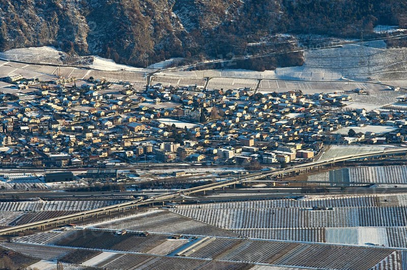 The municipality of Riddes in the Rhone Valley surrounded by vineyards in winter, Riddes, Valais, Switzerland, Europe