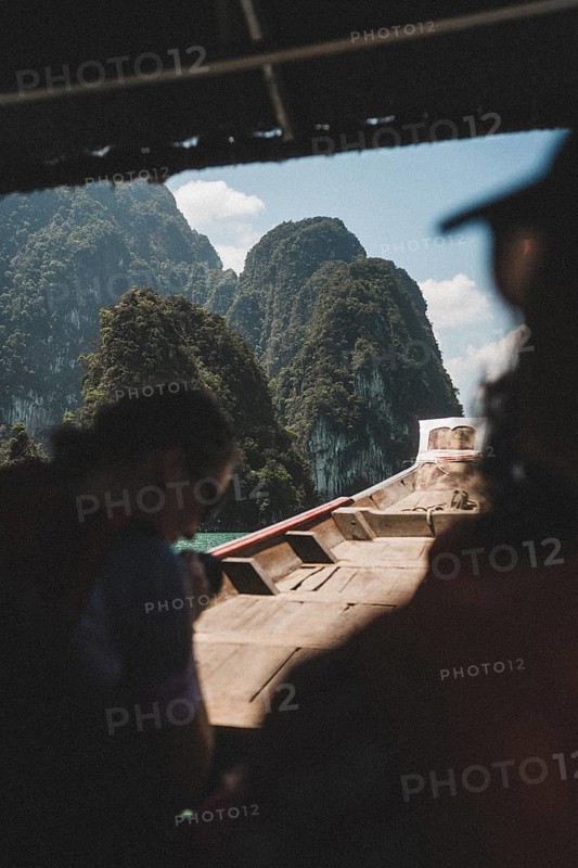 Interior view of a boat with a view of a mountain backdrop. Khao Sok National Park, Thailand, Asia