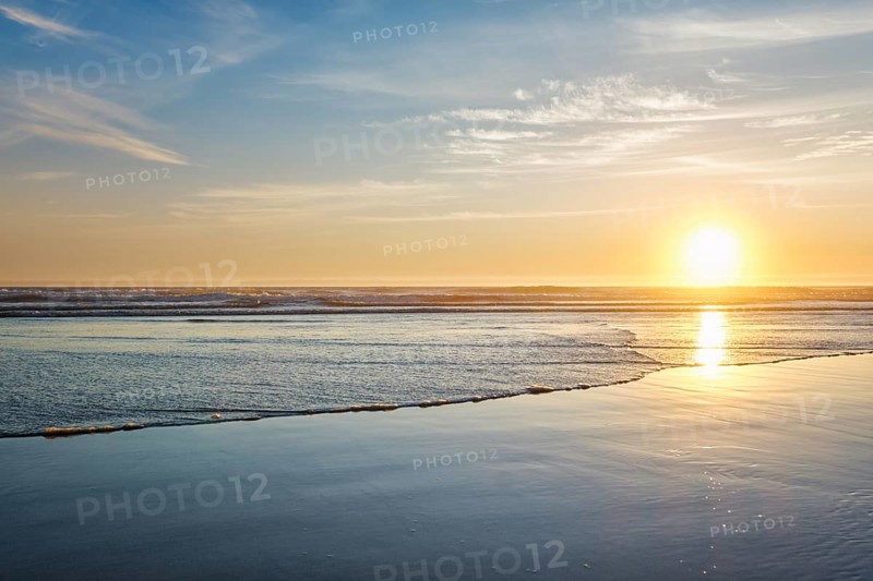 Atlantic ocean sunset with surging waves at Fonte da Telha beach, Costa da Caparica, Portugal, Europe
