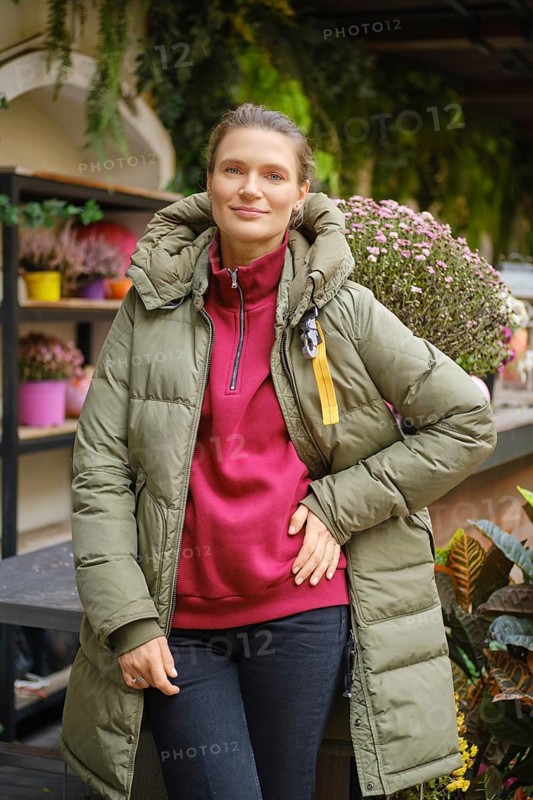 Lovely woman posing on autumn flower county market