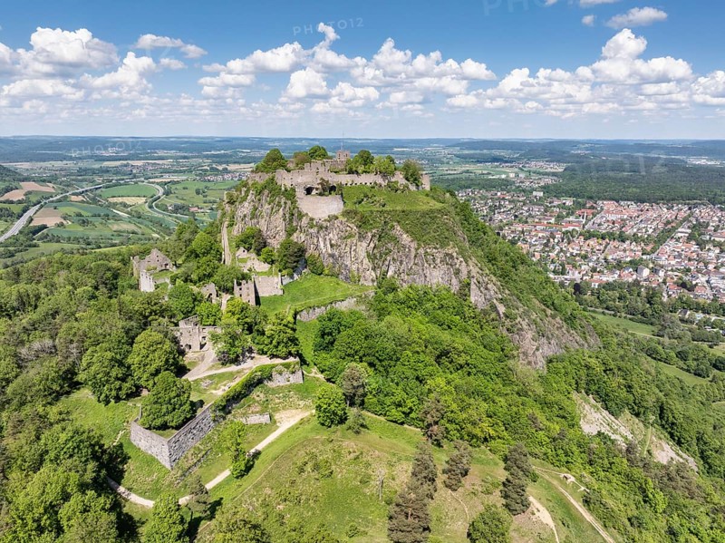 Aerial view of the Hohentwiel volcanic cone with Germany's largest fortress ruins, behind it the town of Singen am Hohentwiel, district of Constance, Baden-Wuerttemberg, Germany, Europe