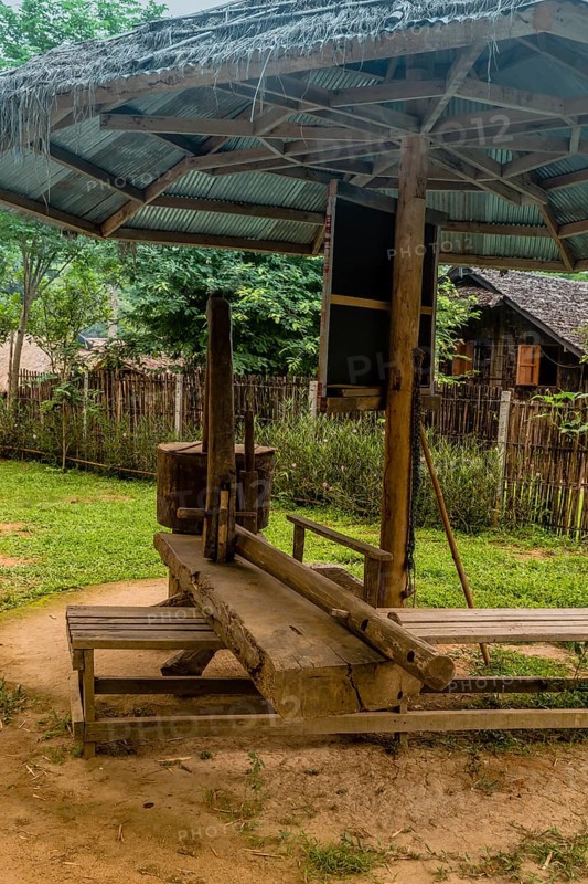 Traditional sesame seed mill and oil press in Thai cultural village in Chiang Khan, Thailand, Asia