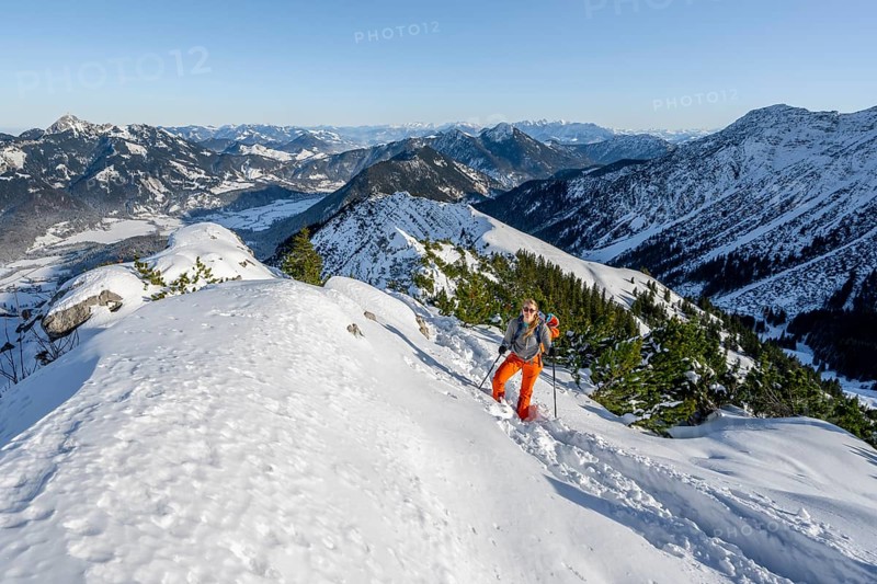 Hiker in winter climbing the Aiplspitz, Mangfall mountains, Bavarian Prealps, Bavaria, Tyrol, Germany, Europe