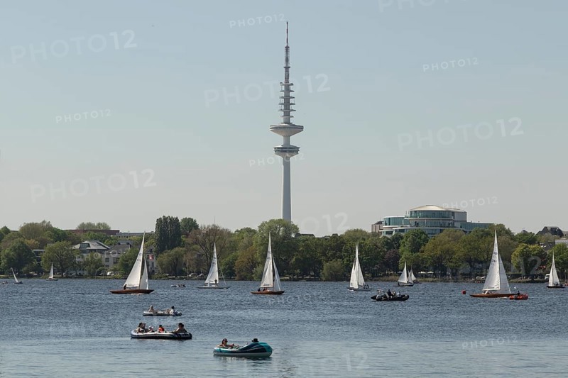 Symbolic picture weather, leisure activity, summer spring, sailing boats, pedal boats and television tower Heinrich-Hertz-Turm in the evening light on the Alster in Hamburg, Germany, Europe