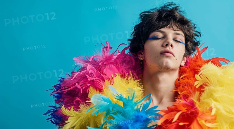 A transgender LGBTQ man wearing a colorful feathery costume with blue, yellow, and red feathers, AI generated