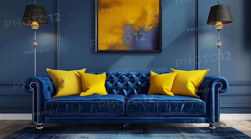 A blue couch with yellow pillows sits in front of a yellow wall. Modern luxury interior design, AI generated