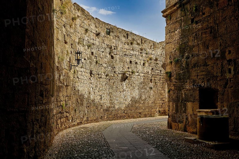 Paved path along an old fortress wall with rich stone texture, Grand Master's Palace, Knights' Town, Rhodes Town, Rhodes, Dodecanese, Greek Islands, Greece, Europe