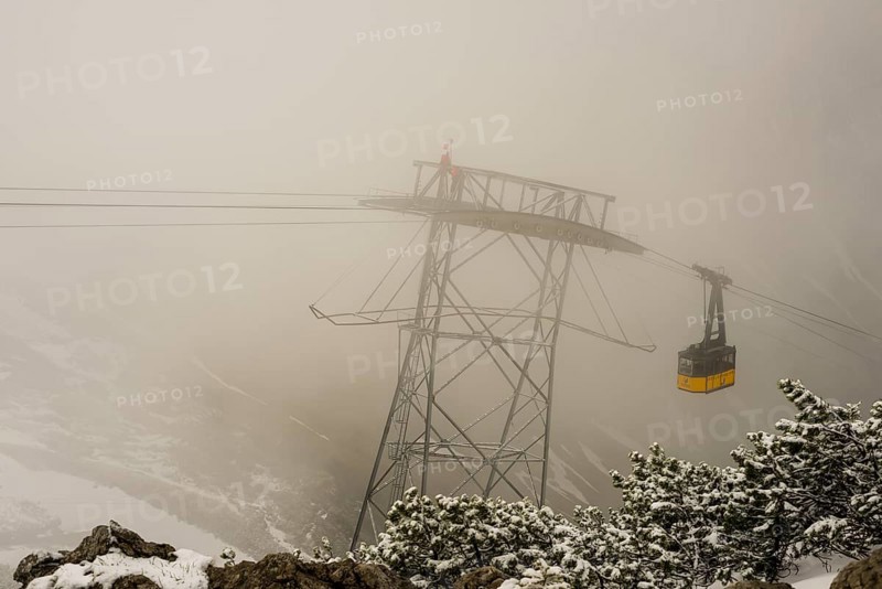 Cable car technicians working in bad weather conditions, Nebelhorn cable car near Oberstdorf, Allgaeu Alps, Allgaeu, Bavaria, Germany, Europe