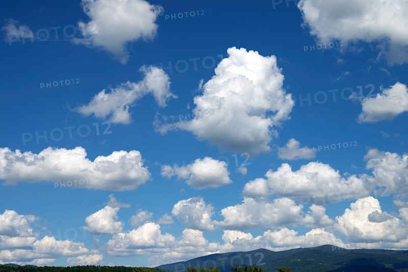 Blue sky with many white clouds over a mountain landscape, Bavarian Forest above Deggendorf, Bavaria, Germany, Europe