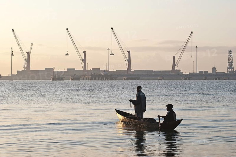Fishermen on the Indian ocean, commercial port of Toamasina, Madagascar, Africa