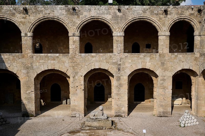Medieval fortress with symmetrical arcades and lion statue in the courtyard, outdoor area, Archaeological Museum, Old Town, Rhodes Town, Rhodes, Dodecanese, Greek Islands, Greece, Europe