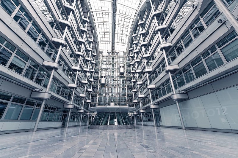Wide-angle shot of a modern office building with glass facades and symmetrical structure, Berlin, IHK, Germany, Europe