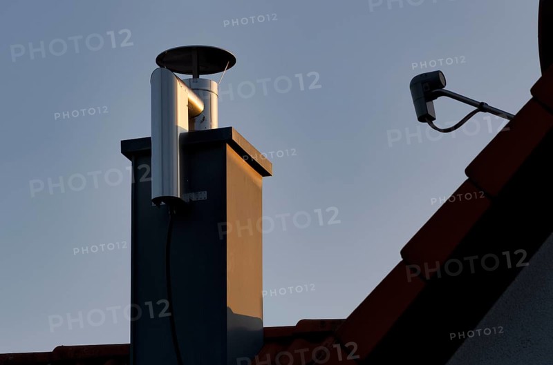 Retrofitted chimney on roof, with dust separator, electrostatic filtering of soot particles from the inside of the flue pipe, power connection, building services, Stuttgart, Baden-Wuerttemberg