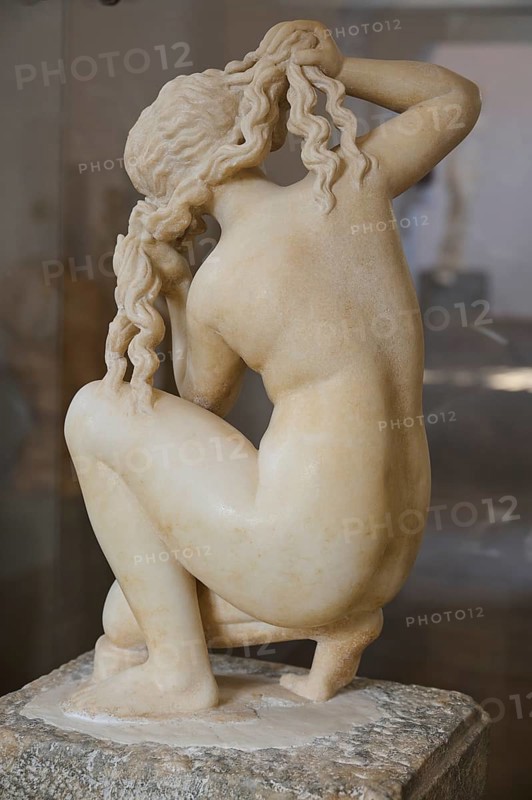 Aphrodite, crouching, rear view of a kneeling female sculpture braiding her hair, graceful and classical, interiors, Archaeological Museum, Old Town, Rhodes Town, Rhodes, Dodecanese, Greek Islands, Greece, Europe