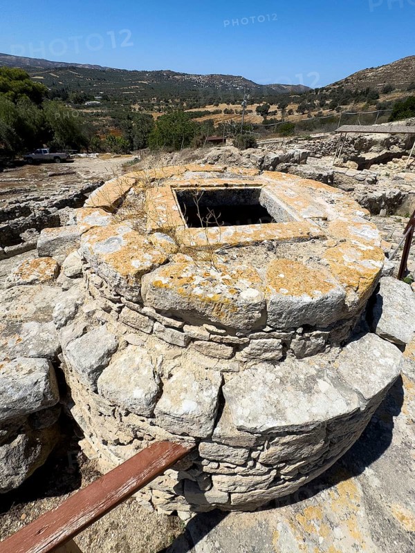 View of Kouloures so-called rings in earth embedded large brick-built round storage tanks in area of Old Palace in excavation site of Minoan culture of pre-Greek ancient Greek people Minoans, hill of Phaistos, Kamilari, Crete, Greece, Europe
