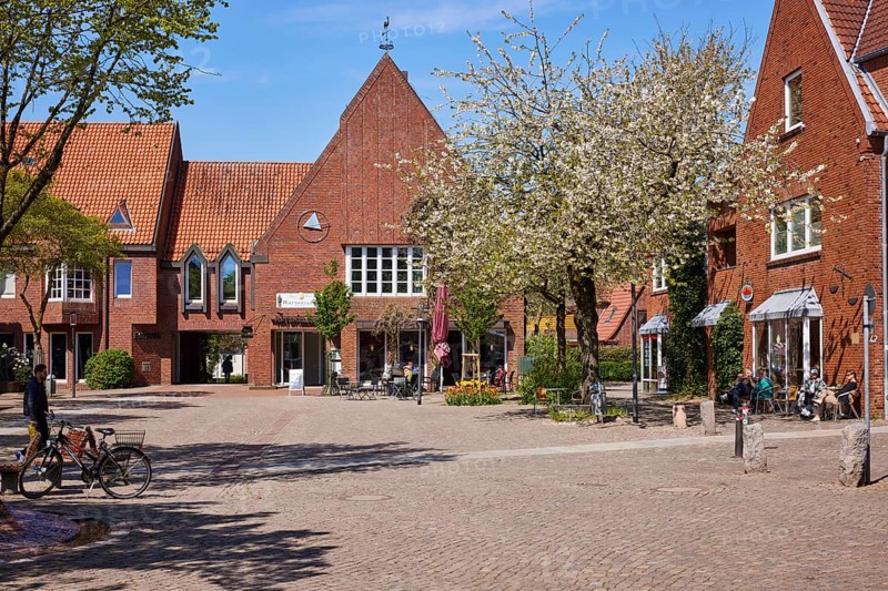 Town hall square with entrance to the Ratskeller restaurant and town hall in Niebuell, Nordfriesland district, Schleswig-Holstein, Germany, Europe