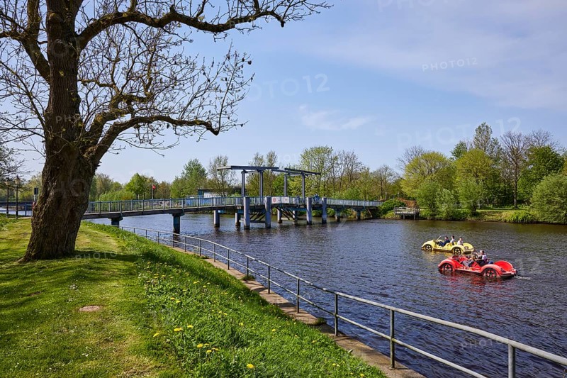 Bascule bridge labelled Blue Bridge and car-shaped pedal boats on the Westersielzug in Friedrichstadt, Nordfriesland district, Schleswig-Holstein, Germany, Europe