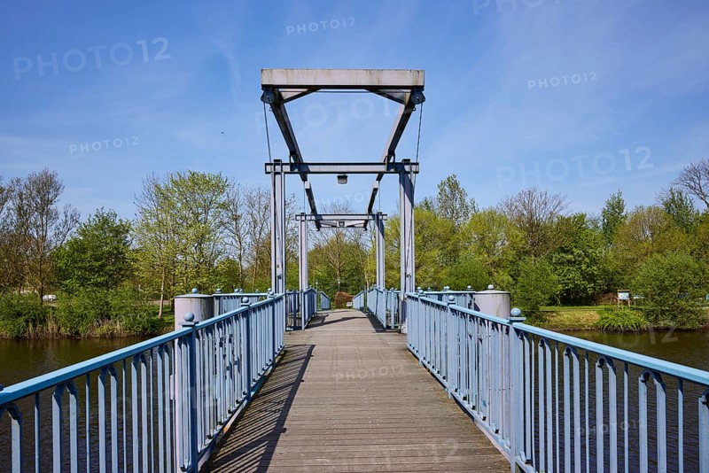 Blue bridge over the Westersielzug in Friedrichstadt, district of Nordfriesland, Schleswig-Holstein, Germany, Europe