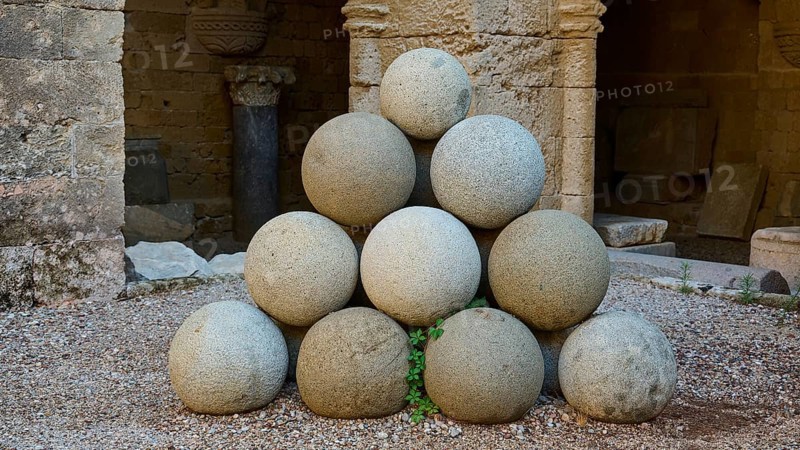 Stone pyramid made of cannonballs in an old fortress, outdoor area, Archaeological Museum, Old Town, Rhodes Town, Rhodes, Dodecanese, Greek Islands, Greece, Europe