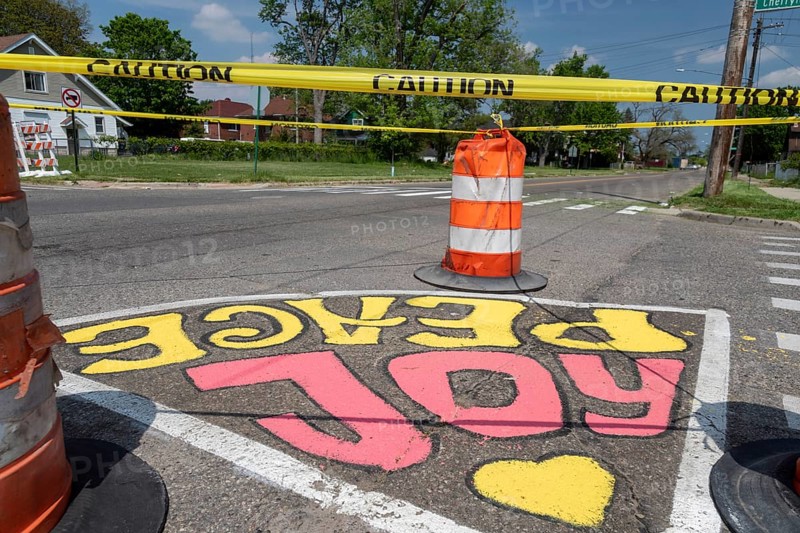 Detroit, Michigan, Artists and students from Noble Elementary-Middle School painted designs on streets near their school. It was part of City Walls, a city program that adds art to Detroit neighborhoods. City Walls has painted more than 200 murals in the city, most of them on walls