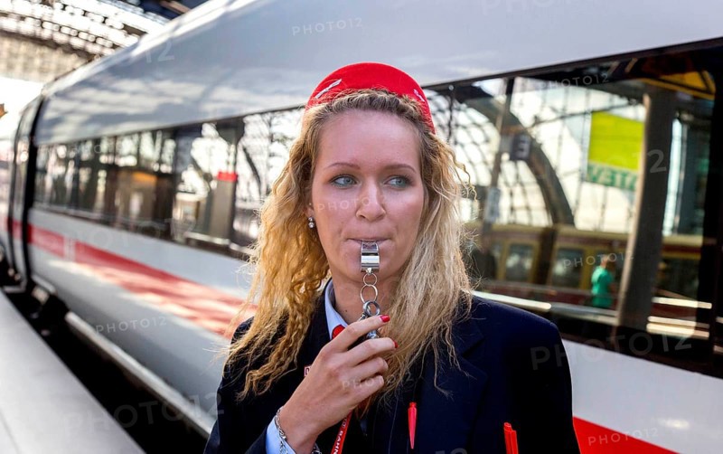 With a whistle, a Deutsche Bahn employee gives the train driver the signal to depart, Berlin, 03/07/2014, Berlin, Germany, Europe