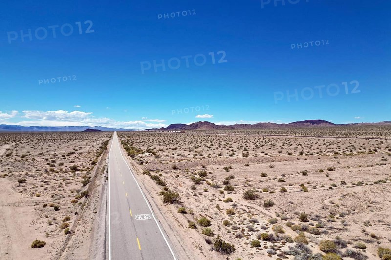 Drone shot of Route 66 with Route 66 sign on the road, Mojave Desert, California