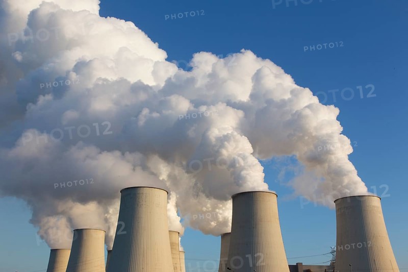 Steam rises from the cooling towers of the Vattenfall power plant in Jaenschwalde on 9 December 2014 The energy company Vattenfall extracts lignite for power generation in the surrounding opencast mines in Brandenburg, Jaenschwalde, Brandenburg, Germany, Europe
