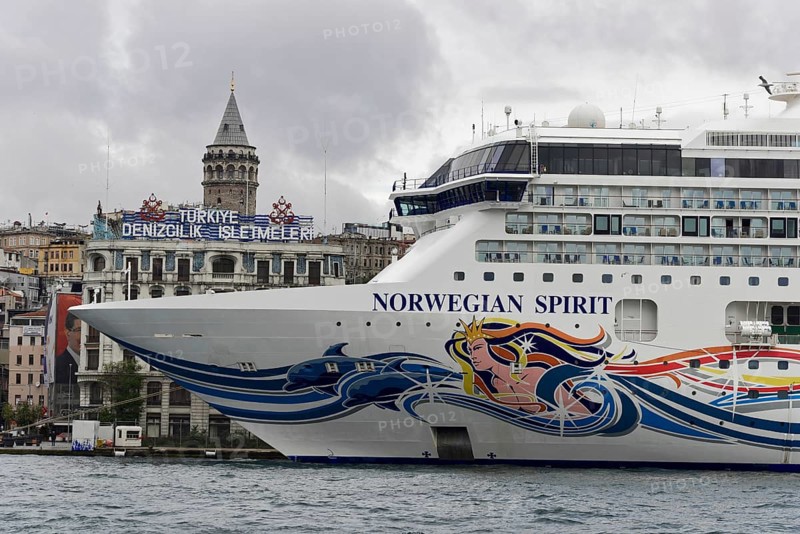 The colourfully painted cruise ship 'Norwegian Spirit' in front of the Galata Tower in Istanbul, Istanbul, Istanbul Province, Turkey, Asia