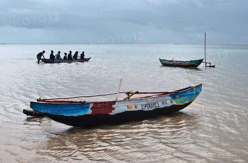 Tourists boating to visit the lagoon, Indian ocean at Foulpointe, Madagascar, Africa