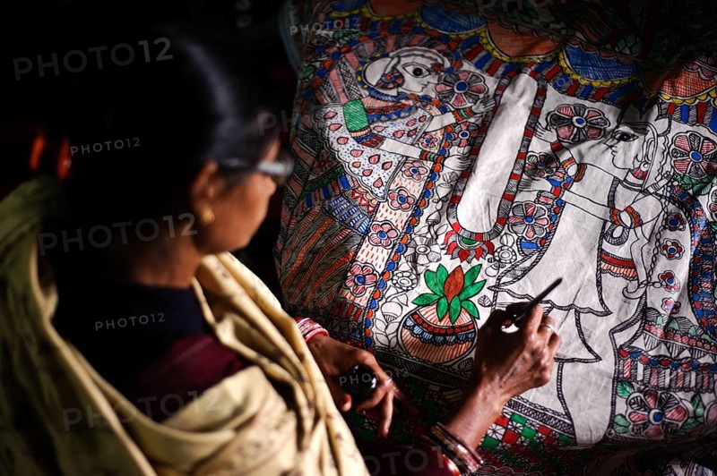 Woman taking drawing lessons in a drawing school, learning the Madhubani style of painting, Bihar, India, Asia
