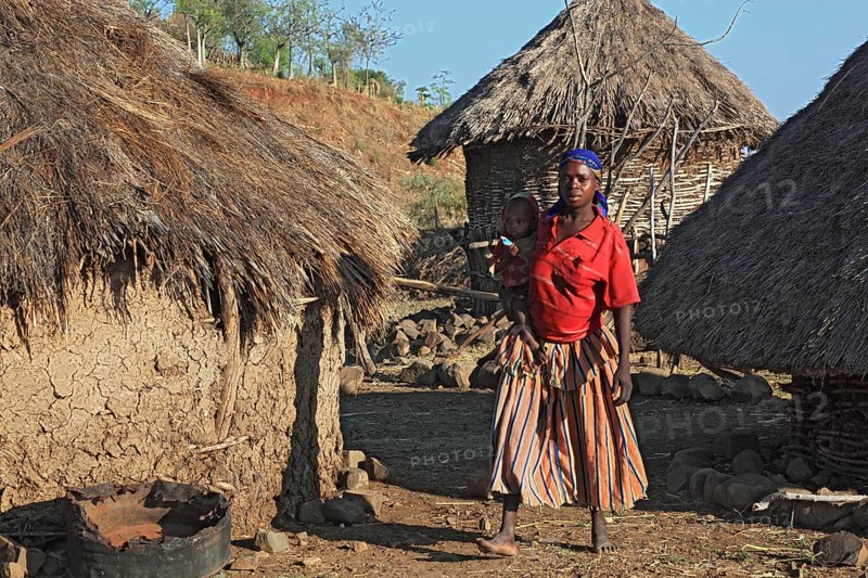 South Ethiopia, among the Konso people, young woman with baby in her arms, Ethiopia, Africa