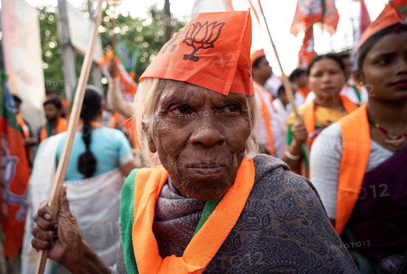 Bharatiya Janata Party (BJP) supporters arrives to to see a roadshow of Union Home minister Amit Shah, ahead of third phase of General Elections, in Guwahati, Assam, India on 29 April 2024