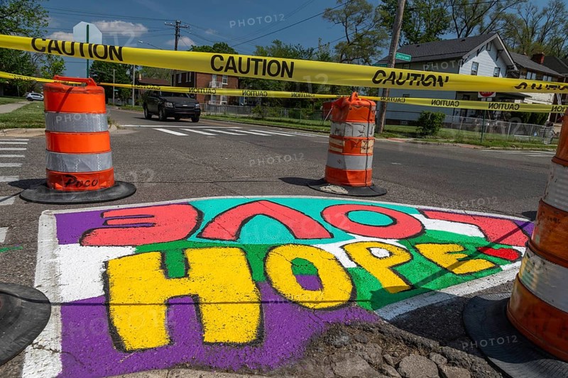 Detroit, Michigan, Artists and students from Noble Elementary-Middle School painted designs on streets near their school. It was part of City Walls, a city program that adds art to Detroit neighborhoods. City Walls has painted more than 200 murals in the city, most of them on walls