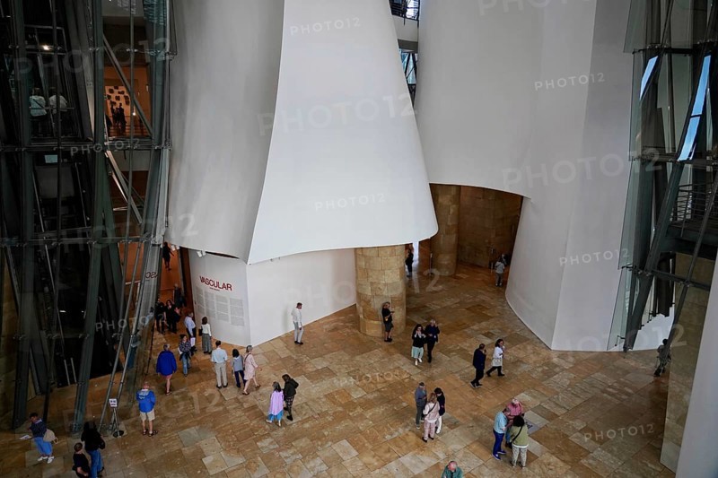 Guggenheim Museum, Bilbao, Basque Country, Spain, Europe, People visit the interior of a modern building with large glass structures and light-coloured walls, Guggenheim Museum Bilbao on the banks of the river Nervion, architect Frank O. Gehry, Europe