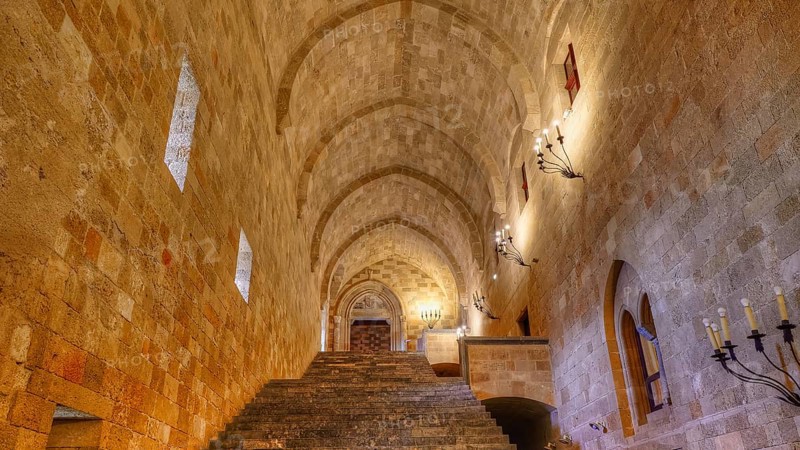 An illuminated corridor with vaulted ceiling and stone stairs in an old fortress, interior view, Grand Master's Palace, Knights' Town, Rhodes Town, Rhodes, Dodecanese, Greek Islands, Greece, Europe