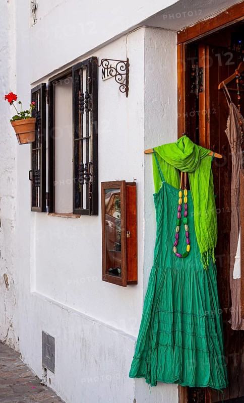 Green dress at the entrance to a fashion shop, Vejer, Andalusia, Spain, Europe