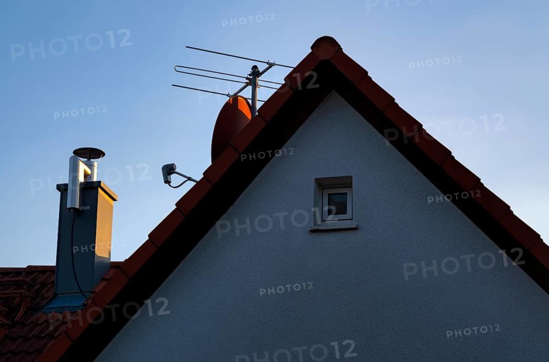 Retrofitted chimney on roof, with dust separator, electrostatic filtering of soot particles from the inside of the flue pipe, power connection, satellite dish, satellite system, aerial, TV, building services, Stuttgart, Baden-Wuerttemberg, Germany, Europe