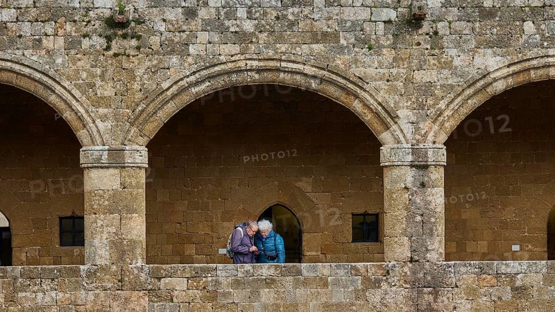 Two people in a stone archway having a dialogue, historical atmosphere, outdoor area, Archaeological Museum, Old Town, Rhodes Town, Rhodes, Dodecanese, Greek Islands, Greece, Europe