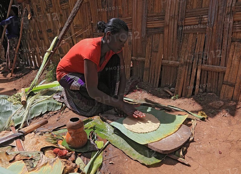 South Ethiopia, among the Dorze people, woman processes the mass of the ground false banana, which is fermented and processed into flatbread, Ethiopia, Africa