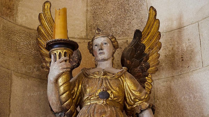 Golden angel sculpture with candle in historical ambience, interior view, Grand Master's Palace, Knights' Town, Rhodes Town, Rhodes, Dodecanese, Greek Islands, Greece, Europe