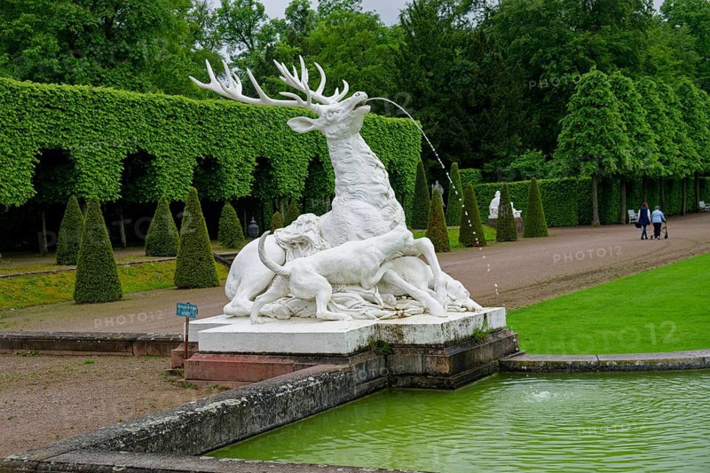 Group of figures of a stag and dogs by Flemish sculptor Peter Anton von Verschaffelt, Schwetzingen Palace Gardens, Schwetzingen, Baden-Wuerttemberg, Germany, Europe