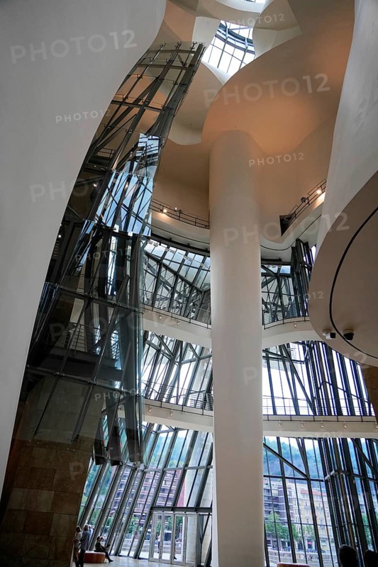 Guggenheim Museum Bilbao, Spain, Europe, The interior is dominated by tall columns and large glass walls, which create a lot of light and an open atmosphere, Guggenheim Museum Bilbao on the banks of the Nervion River, architect Frank O. Gehry, Bilbao, Basque Country, Europe